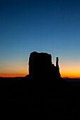 Predawn sky over the West Mitten before sunrise in the Monument Valley Navajo Tribal Park in Arizona.