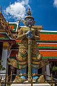 A yaksha guardian statue at the Temple of the Emerald Buddha complex in the Grand Palace grounds in Bangkok, Thailand. A yaksha or yak is a giant guardian spirit in Thai lore.
