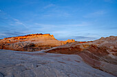 A sandstone mesa at sunset in the White Pocket Recreation Area, Vermilion Cliffs National Monument, Arizona.