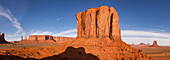 Sunrise view of the Merrick Butte & the monuments in the Monument Valley Navajo Tribal Park in Arizona. L-R: Three Sisters, Mitchell Mesa, Merrick Butte (foreground), Setting Hen, Big Indian Chief, Brigham's Tomb, King on the Throne, Castle Butte, Bear and Rabbit, Stagecoach, East Mitten Butte.