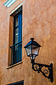 Street lamp and window in the old Colonial City of Santo Domingo, Dominican Republic. A UNESCO World Heritage Site in the Dominican Republic.