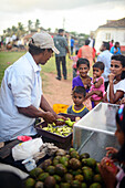 Ambulant food seller in UNESCO World Heritage, Galle Fort, during Binara Full Moon Poya Day.