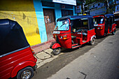 Tuk tuks parked in line, Matale, Sri Lanka