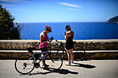 Couple of cyclists resting in Mallorca, Spain