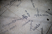 Words written on street floor, street art in Chinatown, San Francisco.