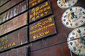 Old wooden clocks and time schedules in train station, Sri Lanka