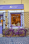Purple bicycle decorates ice cream shop in the streets of Szentendre, a riverside town in Pest County, Hungary,