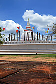 Hand of guide showing photo of Thuparamaya, Anuradhapura, Sri Lanka