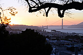 View of San Francisco and Golden Gate Bridge at sunset.