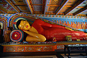 Reclining buddha statue at the Isurumuniya Temple in Anuradhapura, Sri Lanka.