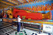 Reclining buddha statue at the Isurumuniya Temple in Anuradhapura, Sri Lanka.