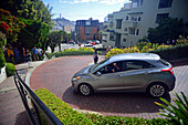 Popular Lombard Street in San Francisco, an east?west street that is famous for a steep, one-block section with eight hairpin turns.