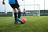 UK, Girls soccer team (12-13) having training in field