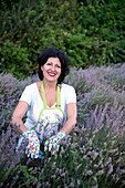 Portrait of smiling woman in lavender field