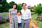 Portrait of smiling family with son (8-9) in lavender field