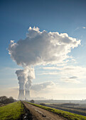 Steam rising from cooling towers of nuclear power plant