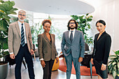 Italy, Portrait of business people standing in creative studio