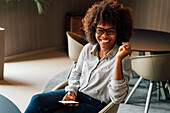 Italy, Portrait of smiling businesswoman in creative studio