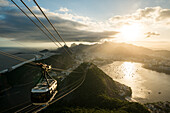 Brazil, Rio de Janeiro, Cable car on Sugarloaf Mountain at sunset