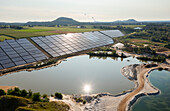 Germany, Herzogenrath, Aerial view of solar panels at sand mine