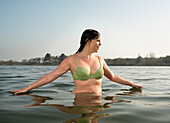 Netherlands, Noord-Brabant, Breda, Woman walking in lake