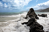 Sea waves crashing against rocks, Sicily, Italy