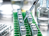 Close-up of test tubes and pipette in lab