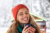 Portrait of smiling woman holding mug