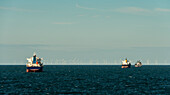 Industrial ships and offshore windfarm on North Sea