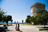 Two Women Walking Past The White Tower; Thessaloniki, Greece