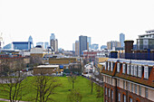 An Urban Park With Skyscrapers In The Distance, Shoreditch; London, England