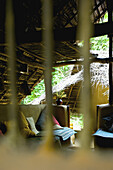 View Through A Window Into A Furnished Area; Ulpotha, Embogama, Sri Lanka