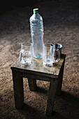 Glasses And A Plastic Bottle On Simple Furniture; Ethiopia