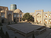 Courtyard Of Hotel Khiva (Formerly Mohammed Amin Khan Madrassah) And Kalta Minar Behind, Ichan Kala Old City; Khiva, Uzbekistan