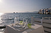 A Seafront Table Set For Dinner In The Little Venice Area; Mykonos Town, Mykonos, Cyclades, Greek Islands, Greece