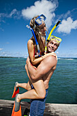 Snorkelers Playing And Having Fun; Uplolu Island, Samoa