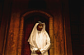 Moor Saudi Standing In A Doorway Of Old Building; Taif, Saudi Arabia