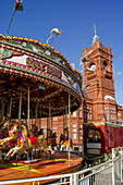 Pierhead Building And Carousel In The Foreground; Cardiff, Wales