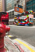 Colourful Double Decker Bus In The Road, Central District; Hong Kong Island, China