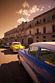 Vintage Cars Parked On The Street; Havana, Cuba
