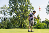 Male Golfer On A Golf Course; Locarno, Ticino, Switzerland