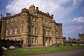 Beautiful historic mansion with cannons on display