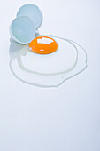 Broken Egg on white surface