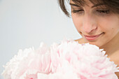 Woman Holding Pink Peonies