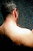 Back View of Man Taking Shower