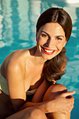 Smiling Woman by Swimming Pool