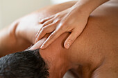 Close up man receiving spine massage