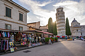 View of souvenir stalls and Leaning Tower of Pisa at sunset, UNESCO World Heritage Site, Pisa, Province of Pisa, Tuscany, Italy, Europe