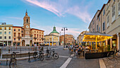 View of restaurant and buildings in Piazza Tre Martiri, Rimini, Emilia-Romagna, Italy, Europe