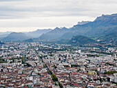 View from the Bastille hill over Grenoble with mountains in the background, Grenoble, Auvergne-Rhone-Alpes, France, Europe